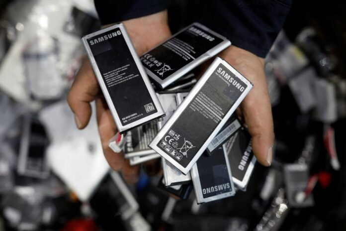 Old smartphone batteries are seen at an urban mining plant in Gunsan